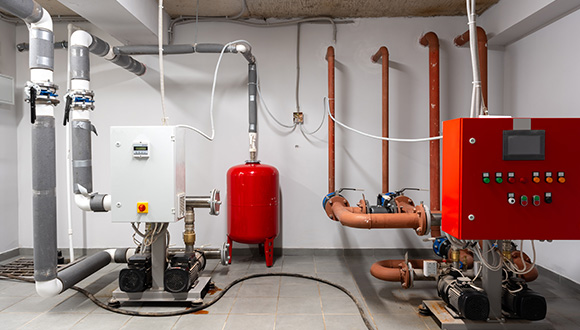 industrial equipment system featuring pumps and pipes in a mechanical room with a control panel showcasing advanced technology for optimal performance in water systems 10 essential components
